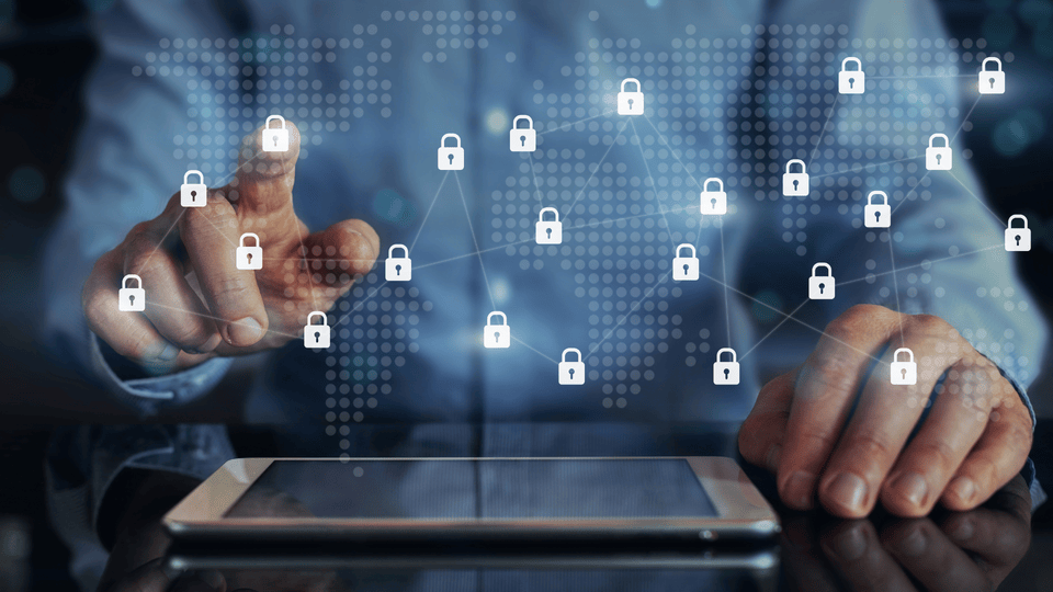 Businessman touching interconnected padlock icons across a digital network — representing third-party and supply chain cyber risk across connected vendor systems